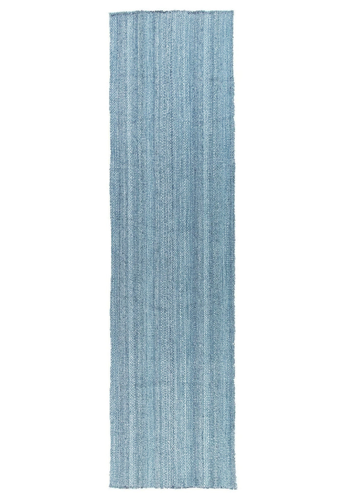Textured artisan wool rug with subtle pattern